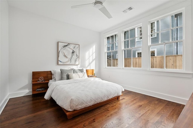 bedroom with wood-type flooring and ceiling fan