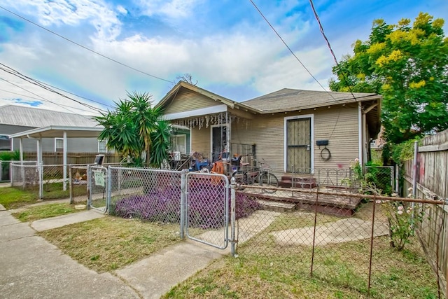 bungalow-style house featuring a front yard