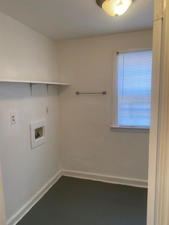 laundry room featuring washer hookup and tile flooring