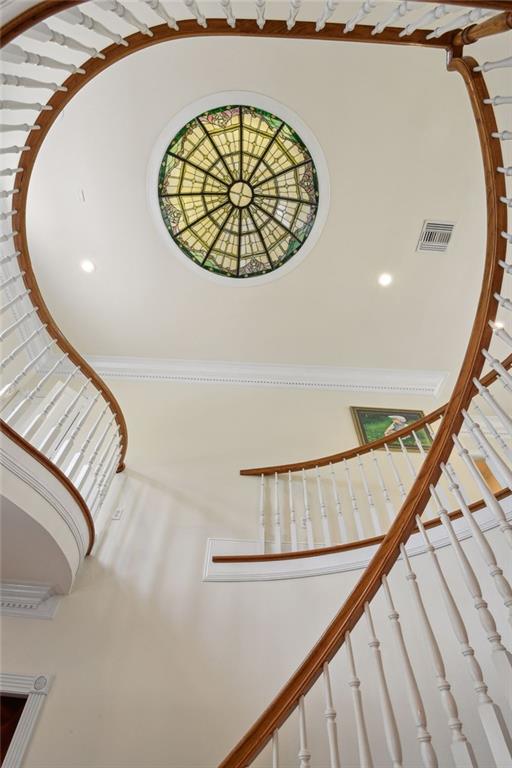 staircase with crown molding