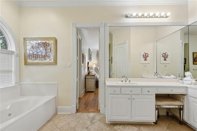 bathroom with a bathing tub, tile patterned flooring, crown molding, and vanity