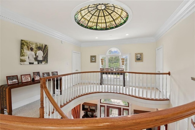 stairs with ornamental molding, french doors, and carpet