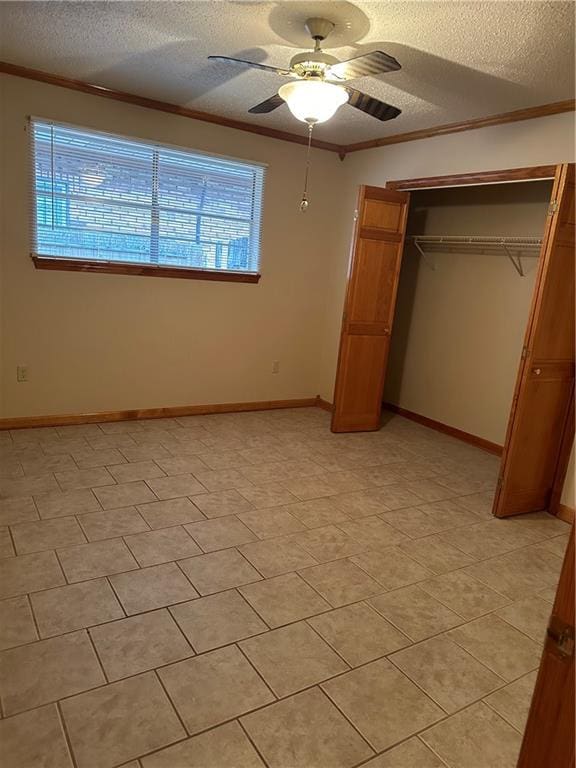 unfurnished bedroom featuring a closet, ceiling fan, and light tile floors