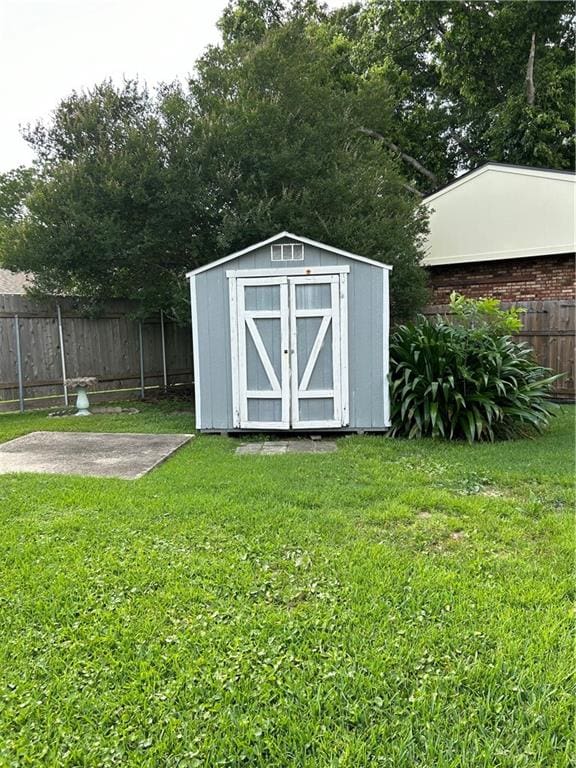 view of outdoor structure with a lawn