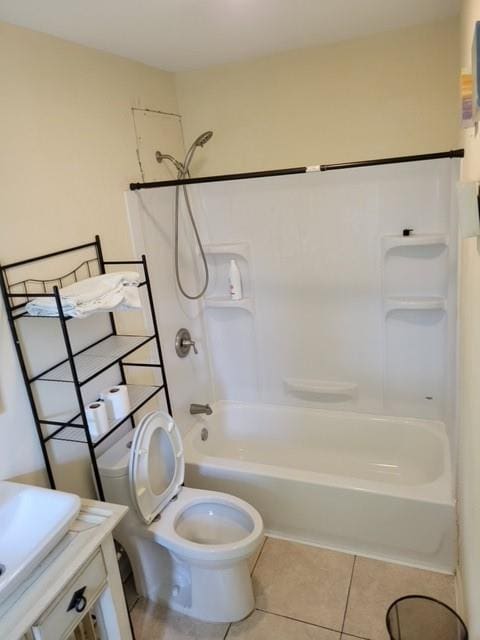 full bathroom with tile flooring, shower / tub combination, sink, and toilet