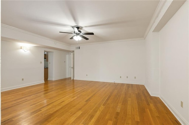 empty room with light hardwood / wood-style flooring, ceiling fan, and ornamental molding