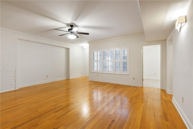 unfurnished room with ceiling fan, crown molding, and light wood-type flooring