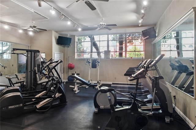 exercise room featuring ceiling fan and track lighting