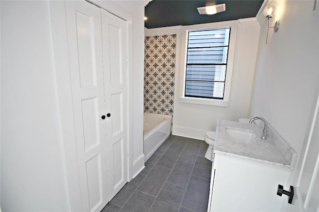 bathroom featuring vanity, tile floors, and toilet