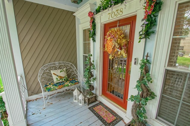 doorway to property featuring covered porch