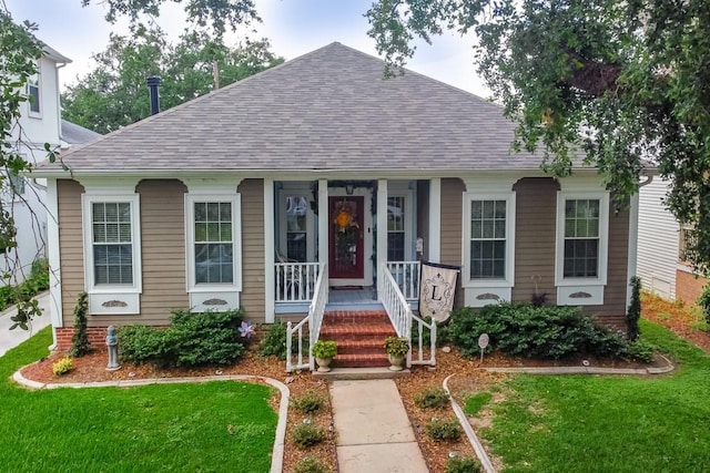 view of front of home featuring a front lawn and a porch