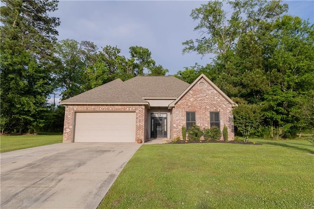 view of front of house with a garage and a front yard