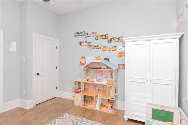 recreation room with wood-type flooring