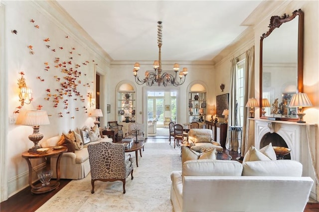 living room featuring crown molding, hardwood / wood-style flooring, and a notable chandelier