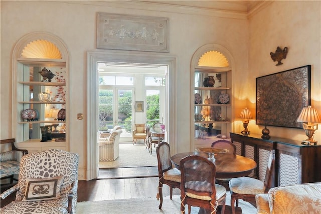 dining room featuring ornamental molding and hardwood / wood-style floors