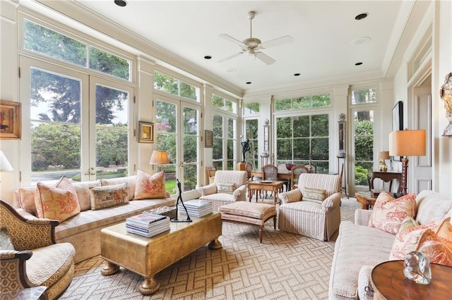 sunroom featuring french doors, plenty of natural light, and ceiling fan