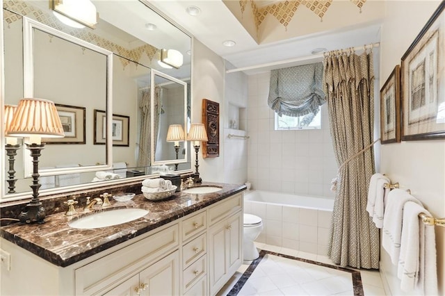 bathroom featuring vanity, toilet, and tile patterned flooring