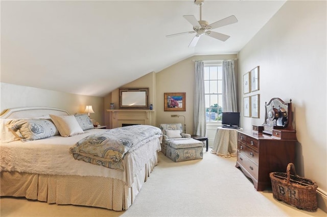 bedroom with light colored carpet, vaulted ceiling, and ceiling fan