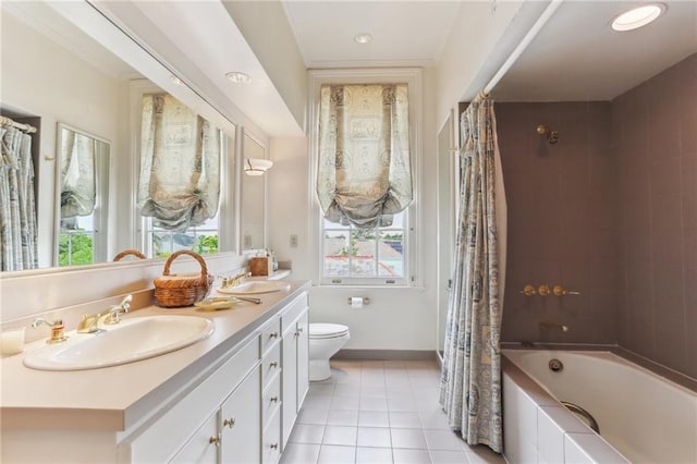 full bathroom featuring vanity, toilet, shower / bath combo with shower curtain, and tile patterned flooring