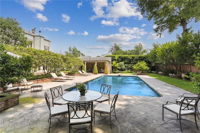 view of swimming pool with a patio area