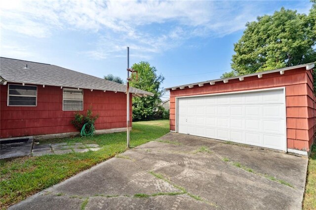 garage with a yard