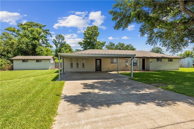 ranch-style home featuring a carport and a front lawn