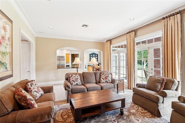 living room featuring carpet floors, french doors, and crown molding