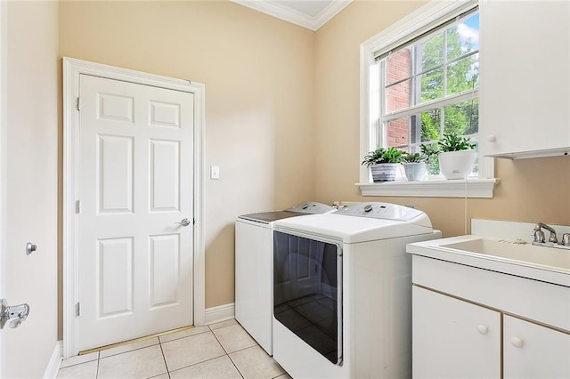 washroom with independent washer and dryer, cabinets, light tile flooring, crown molding, and sink