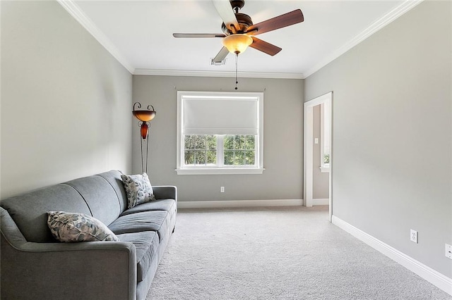 living room with ceiling fan, carpet floors, and ornamental molding