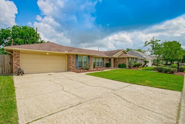 single story home featuring a garage and a front yard