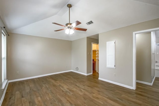 unfurnished room featuring ceiling fan, vaulted ceiling, and dark hardwood / wood-style flooring