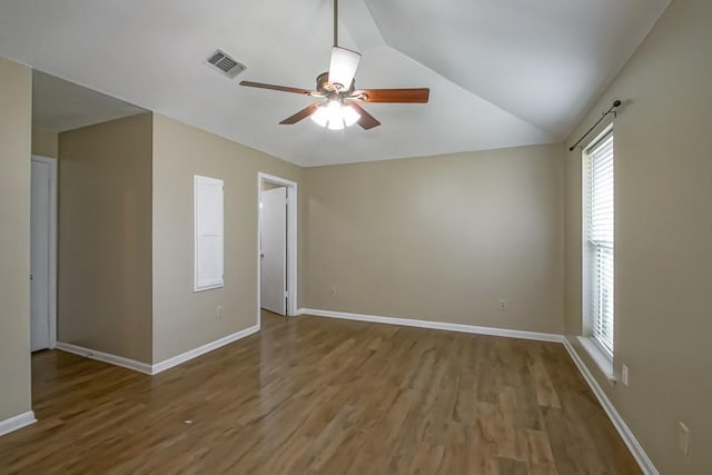 2545 Kismet St, Marrero, LA 70072 - spare room with ceiling fan, healthy amount of natural light, wood finished floors, and lofted ceiling