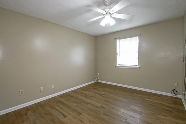 2545 Kismet St, Marrero, LA 70072 - empty room with baseboards, wood finished floors, and a ceiling fan