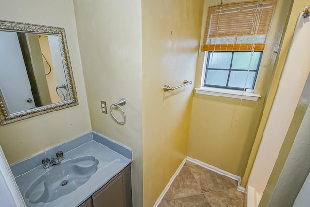 bathroom with tile floors and vanity