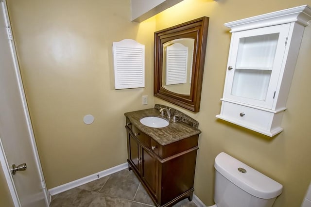 2545 Kismet St, Marrero, LA 70072 - bathroom featuring vanity, toilet, baseboards, and tile patterned floors