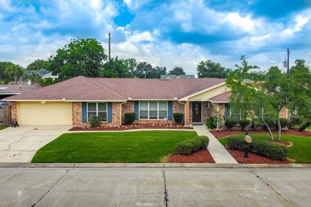 ranch-style house with a front yard and a garage