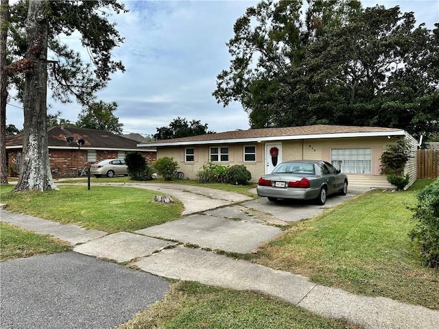 single story home featuring a front yard