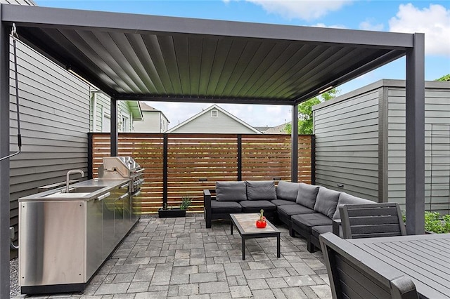 view of patio featuring area for grilling, an outdoor living space, and sink