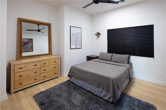 bedroom with ceiling fan and light hardwood / wood-style floors