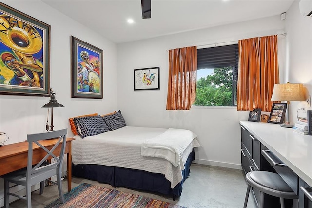 bedroom featuring concrete floors