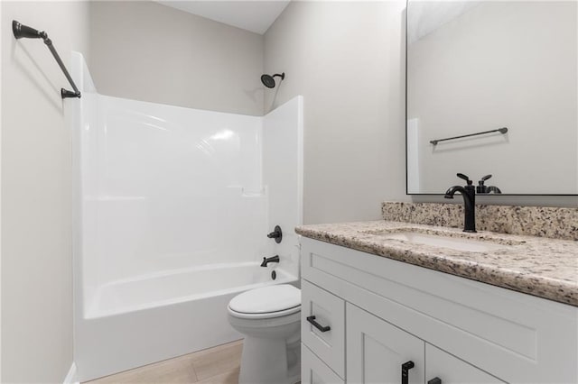 full bathroom featuring washtub / shower combination, vanity, toilet, and tile patterned floors