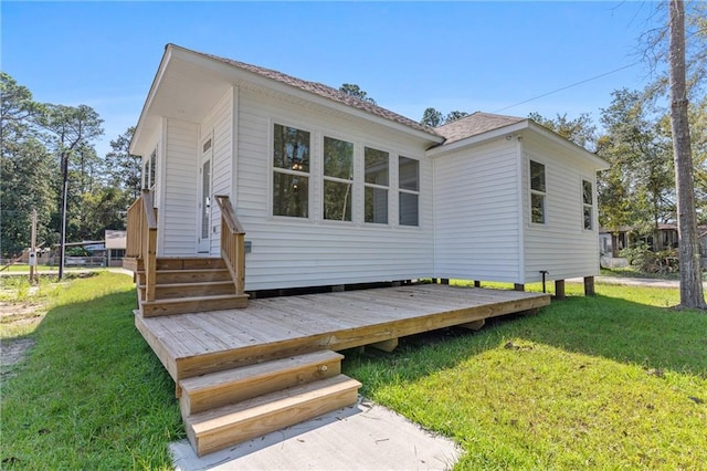 exterior space with a deck and a yard