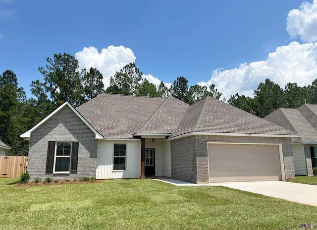 view of front of home featuring a garage and a front yard