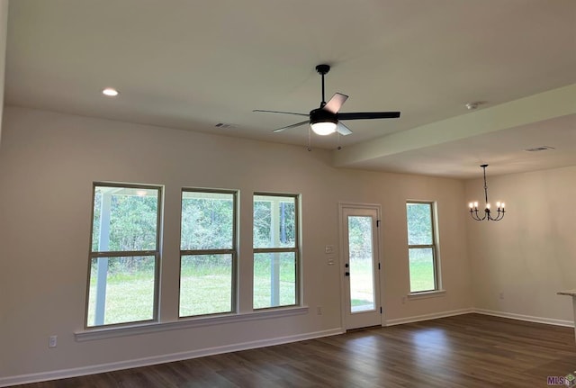 doorway with ceiling fan with notable chandelier and dark hardwood / wood-style flooring