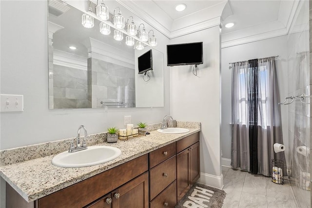 bathroom featuring ornamental molding, dual sinks, tile floors, and large vanity