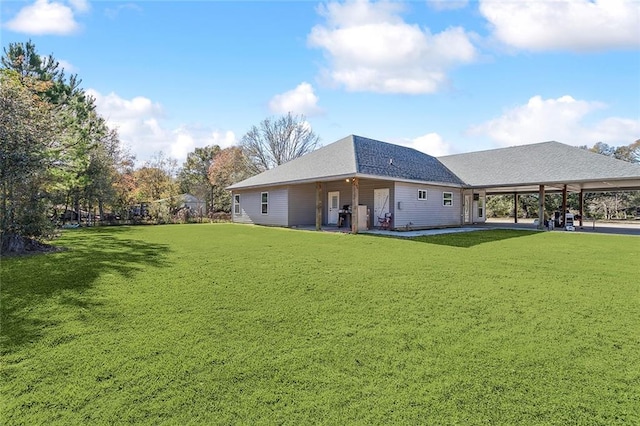 exterior space featuring a patio area and a lawn