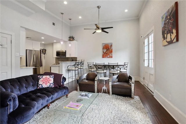 living room with high vaulted ceiling, ceiling fan, ornamental molding, and dark wood-type flooring