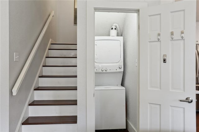 stairs with stacked washer and dryer