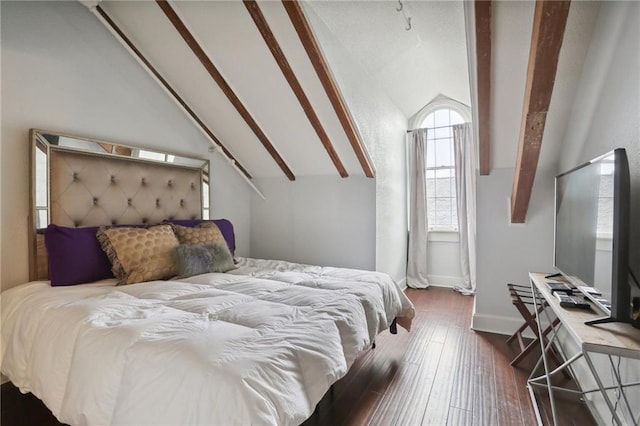 bedroom featuring lofted ceiling with beams and hardwood / wood-style flooring