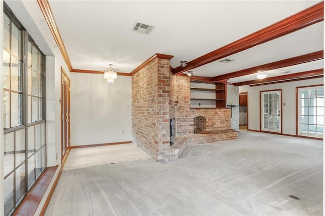 unfurnished living room with carpet floors, a brick fireplace, a notable chandelier, and ornamental molding